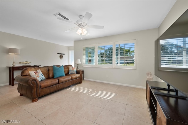 living room with ceiling fan and light tile patterned floors