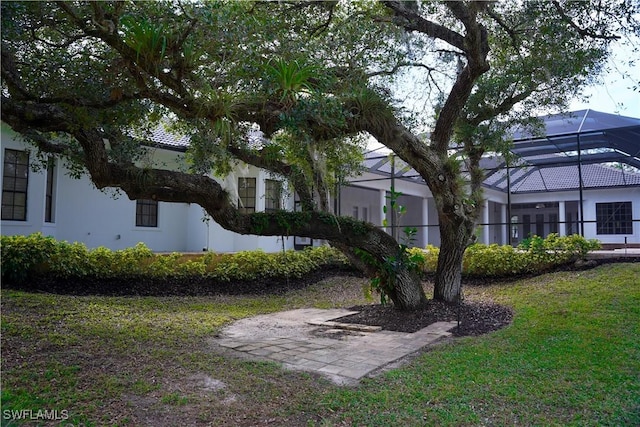 view of yard featuring a lanai