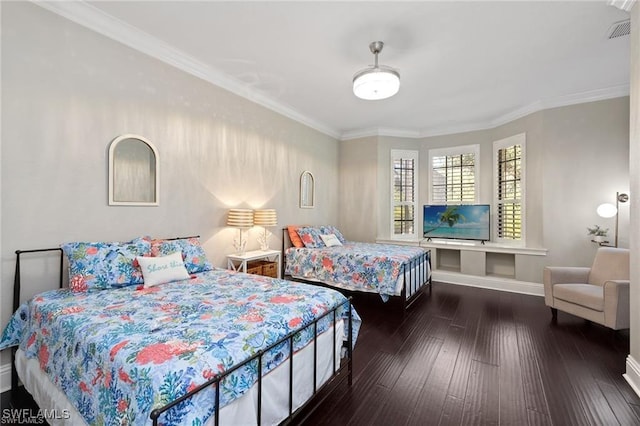 bedroom featuring dark hardwood / wood-style flooring and ornamental molding