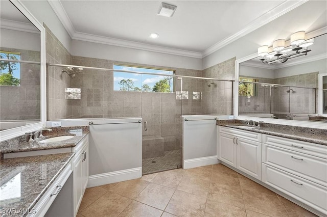 bathroom with vanity, tile patterned floors, a shower with door, and ornamental molding