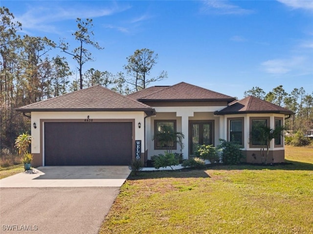 view of front of house with a front lawn and a garage