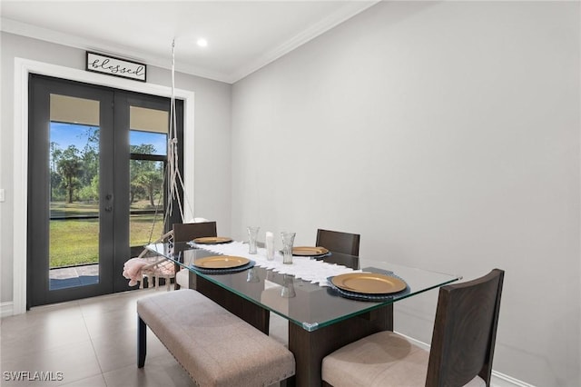 dining space with french doors, a healthy amount of sunlight, and ornamental molding