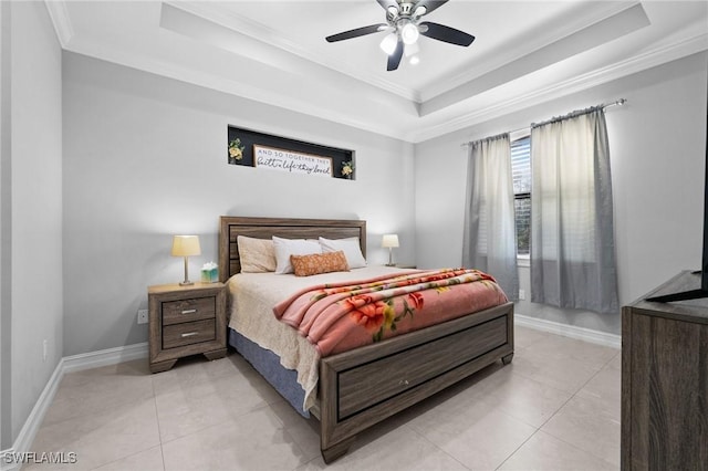 tiled bedroom featuring a tray ceiling, ceiling fan, and ornamental molding