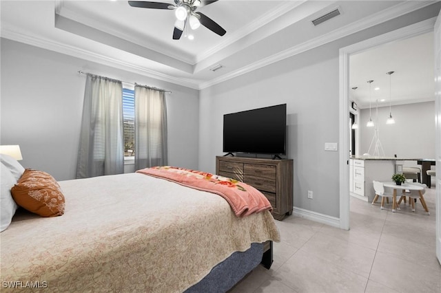 bedroom with light tile patterned floors, a raised ceiling, ceiling fan, and ornamental molding