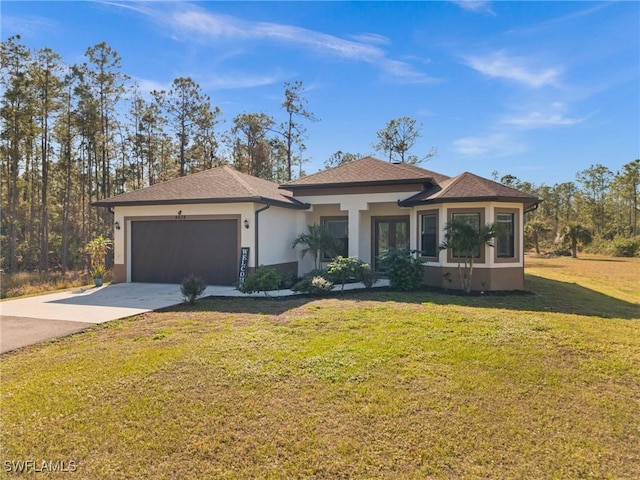 view of front of home featuring a front lawn and a garage