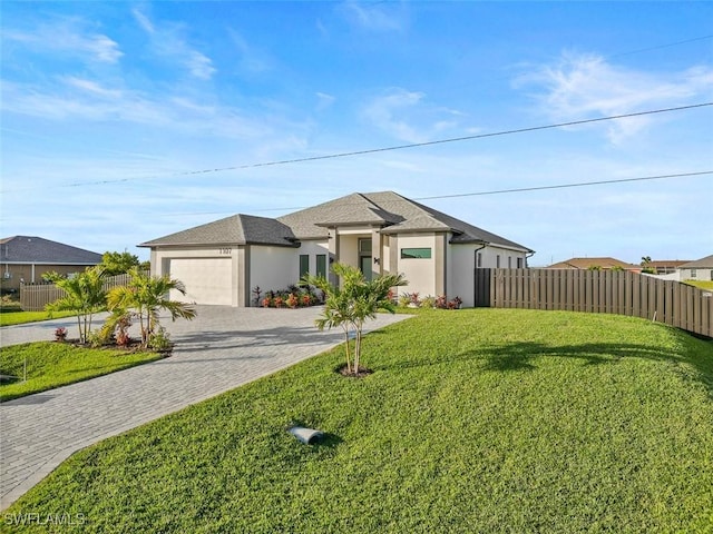 view of front facade featuring a front lawn and a garage