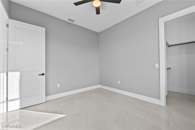 unfurnished bedroom featuring ceiling fan