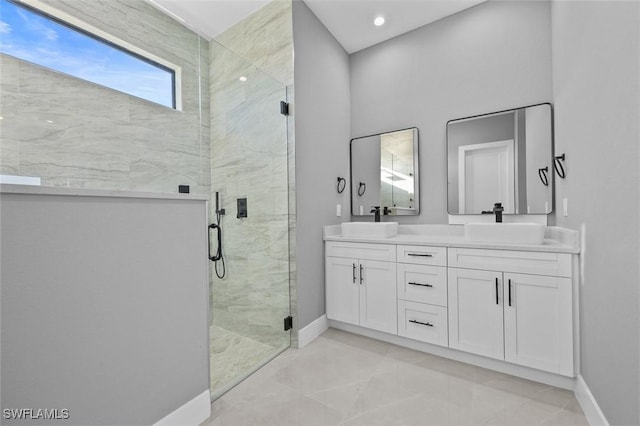 bathroom featuring vanity and a shower with door