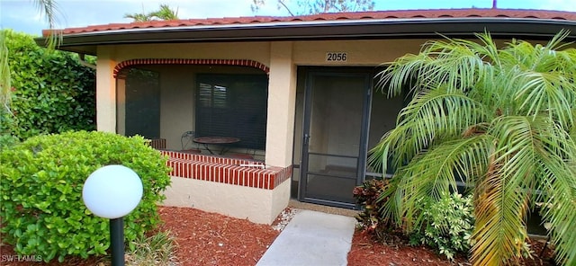 2056 Pine Isle Ln Unit 2056, Naples, FL 34112 - view of exterior entry with stucco siding