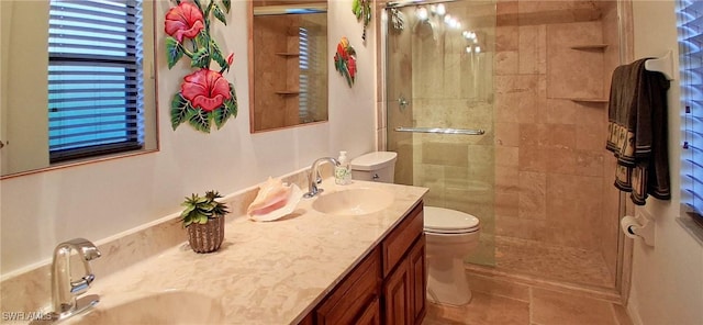 2056 Pine Isle Ln Unit 2056, Naples, FL 34112 - bathroom featuring toilet, double vanity, a shower stall, and tile patterned flooring