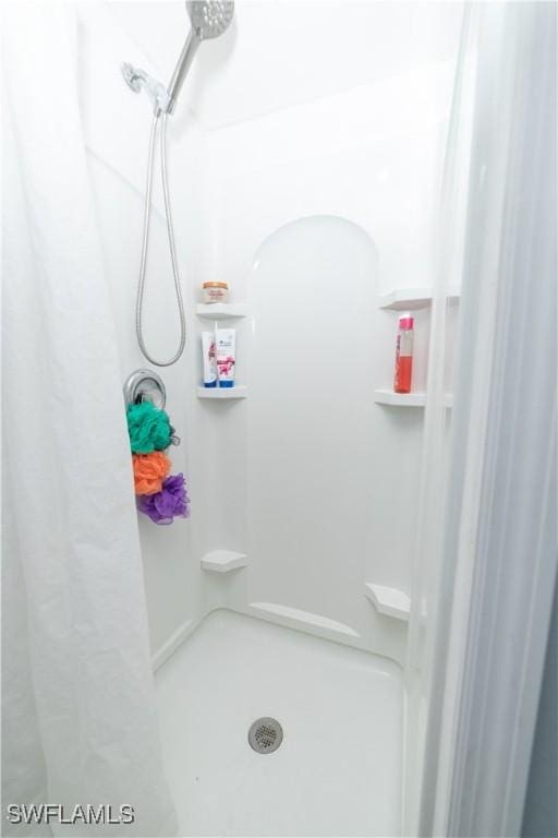 bathroom with a shower with shower curtain