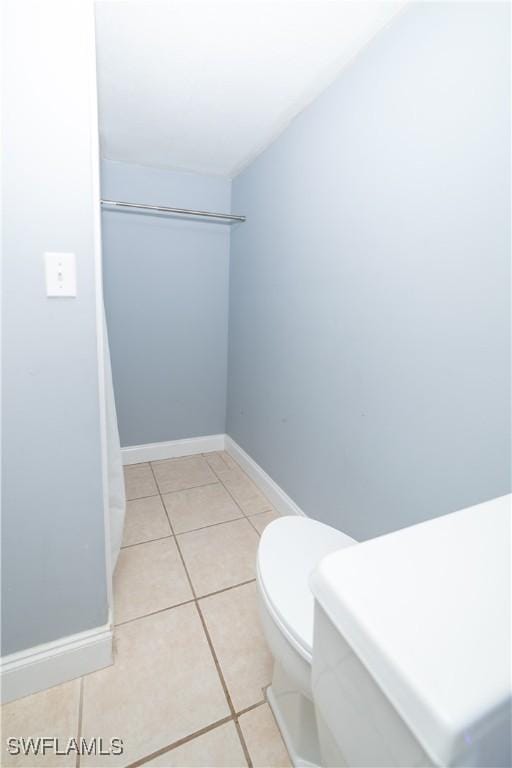 bathroom featuring tile patterned floors and toilet