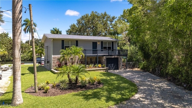 view of front facade featuring a front yard and a garage