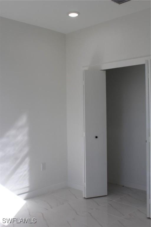 unfurnished bedroom featuring a closet