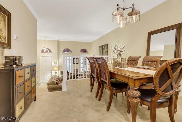 tiled dining room with crown molding and a notable chandelier