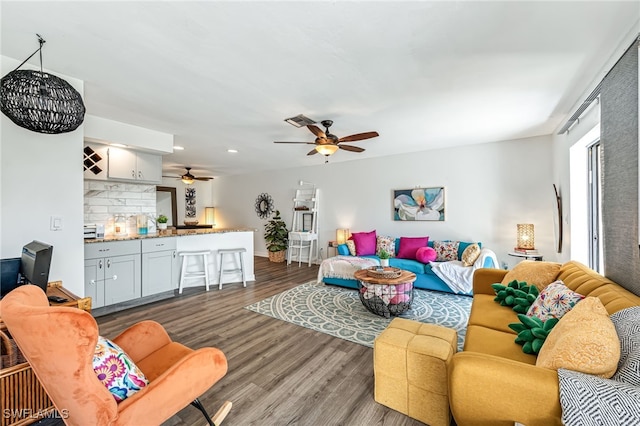 living room with dark hardwood / wood-style flooring