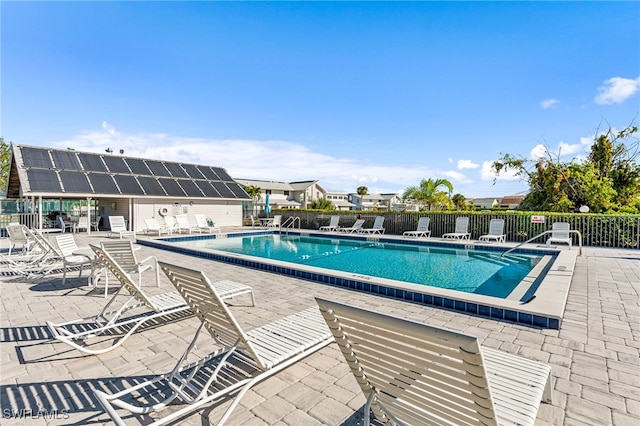 view of swimming pool with a patio