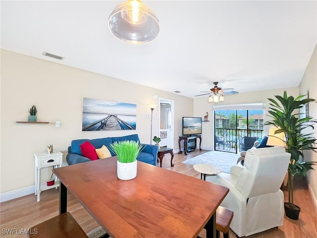 dining space featuring ceiling fan and light hardwood / wood-style floors