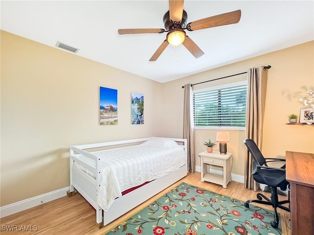 bedroom featuring ceiling fan and light hardwood / wood-style floors