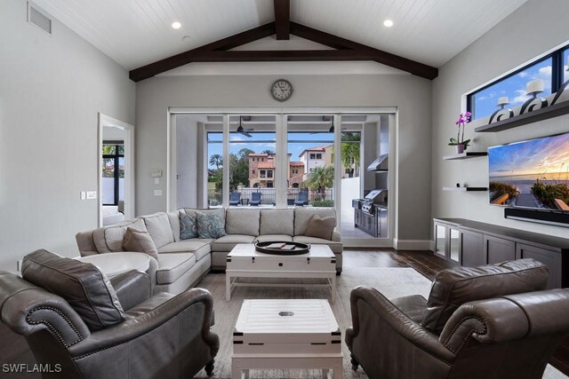 living room featuring vaulted ceiling with beams, ceiling fan, and dark hardwood / wood-style flooring