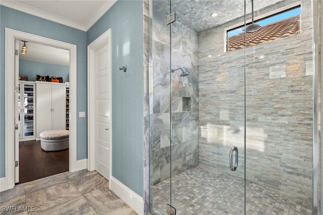 16460 Talis Park Dr, Naples, FL 34110 - full bathroom featuring a shower stall, a spacious closet, crown molding, baseboards, and marble finish floors