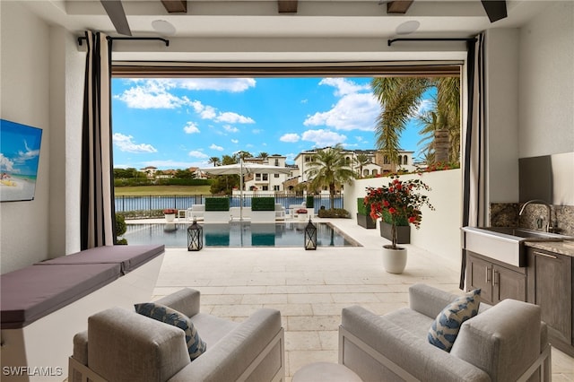 interior space featuring a water view and sink