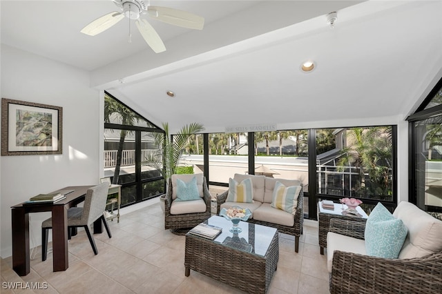 sunroom with ceiling fan and lofted ceiling with beams