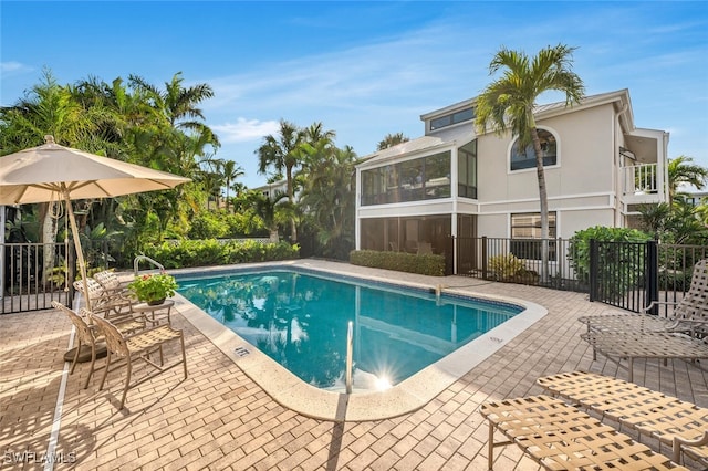 view of pool with a fenced in pool, a patio, and fence