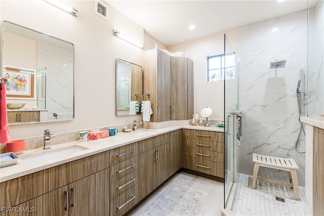 bathroom featuring tile patterned floors, an enclosed shower, and vanity