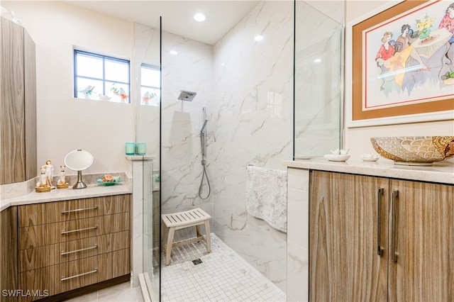 bathroom featuring vanity and a tile shower