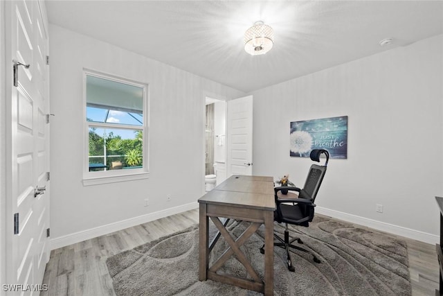 office space with hardwood / wood-style flooring