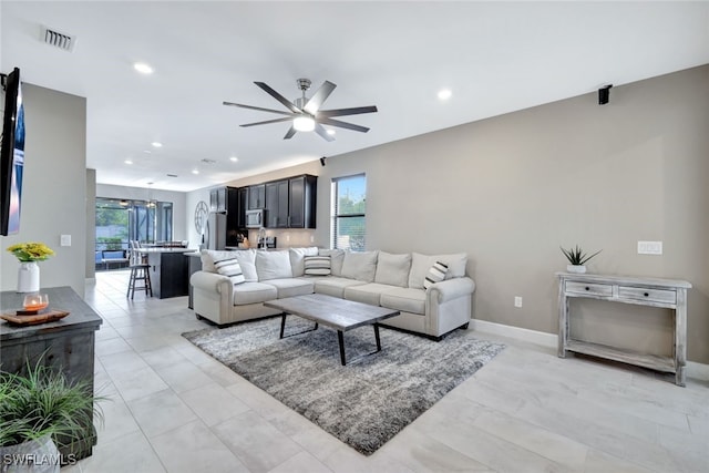 living room featuring ceiling fan