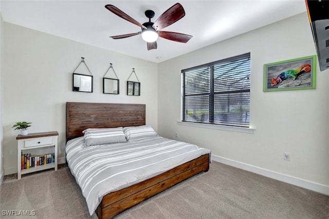 bedroom featuring ceiling fan and light colored carpet