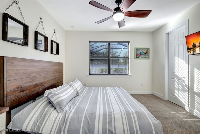 unfurnished bedroom featuring ceiling fan and light carpet