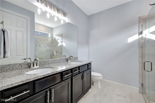 bathroom featuring tile patterned flooring, vanity, an enclosed shower, and toilet