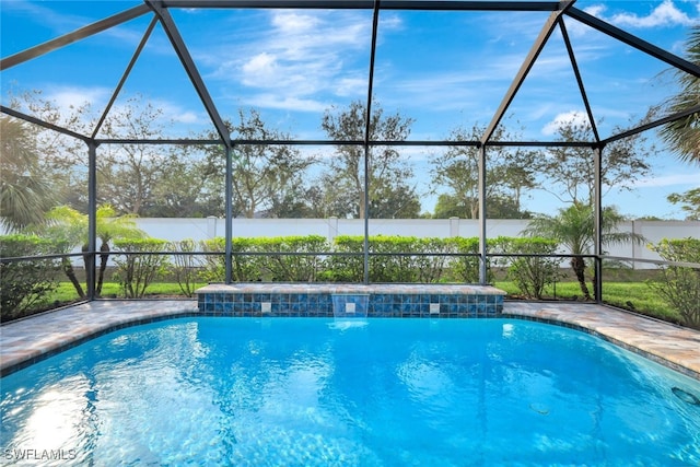 view of pool featuring a lanai