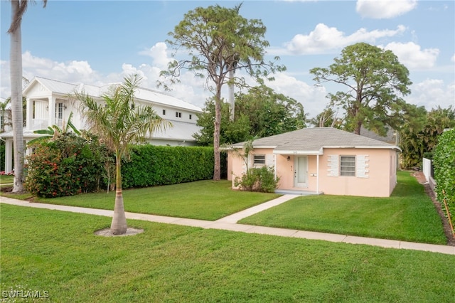 view of front of property with a front lawn