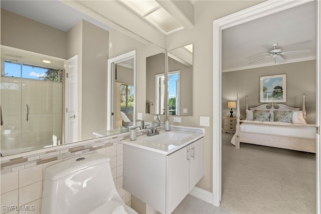 bathroom with vanity, ceiling fan, and walk in shower