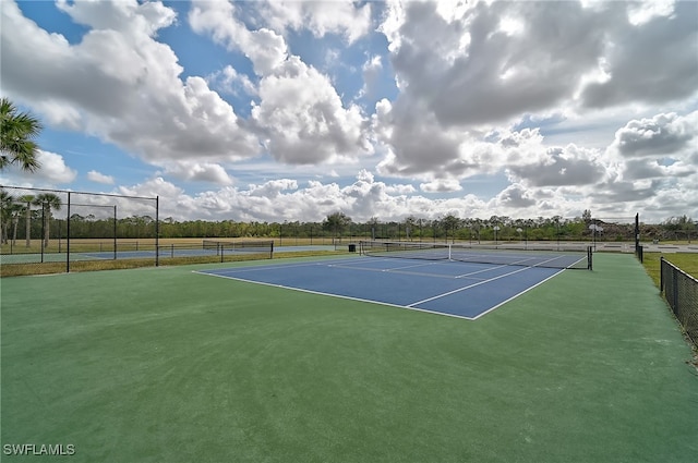 view of tennis court featuring basketball court