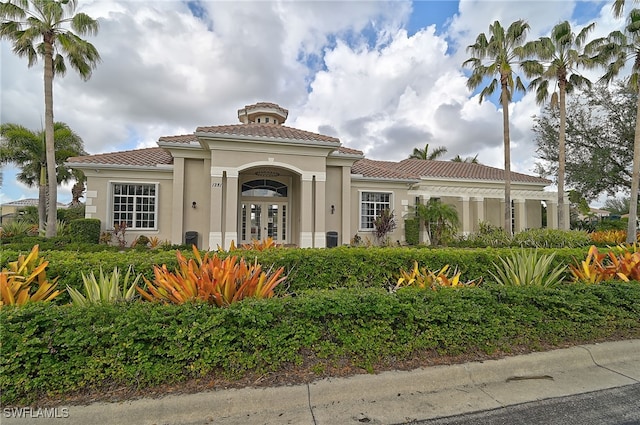 mediterranean / spanish-style house featuring french doors