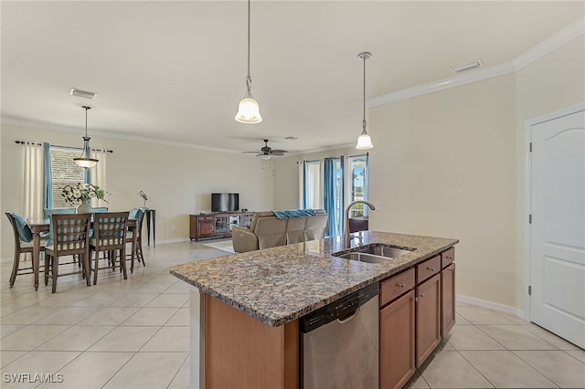 kitchen featuring dishwasher, decorative light fixtures, a kitchen island with sink, and sink