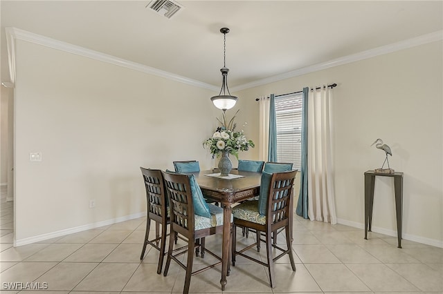 dining area featuring light tile patterned floors and ornamental molding