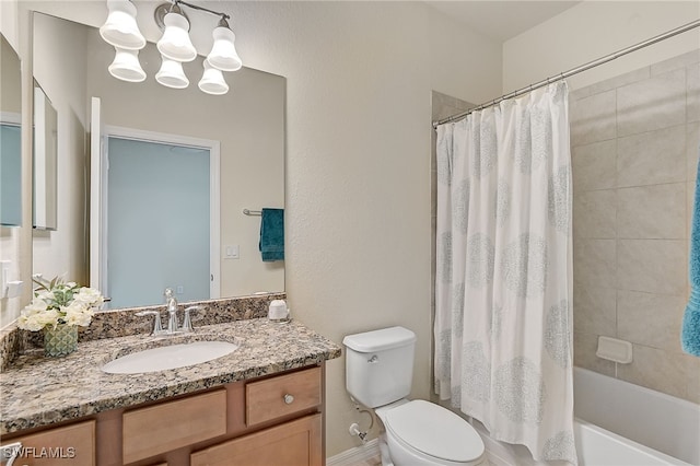 full bathroom with a chandelier, vanity, toilet, and shower / tub combo with curtain