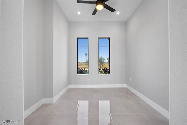 spare room with light tile patterned floors, ceiling fan, recessed lighting, and baseboards