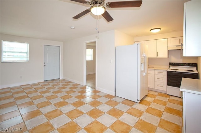 kitchen with ceiling fan, plenty of natural light, white cabinets, and white appliances