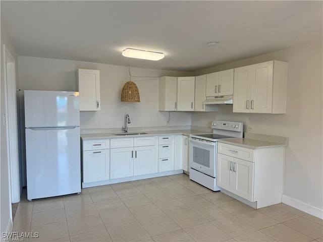 kitchen with white cabinets, white appliances, sink, and light tile patterned floors