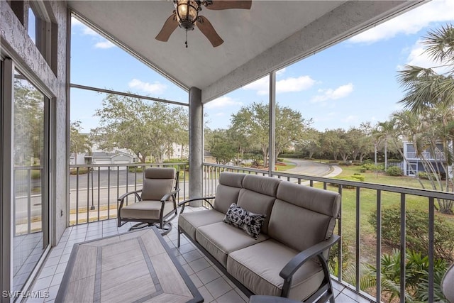 sunroom featuring ceiling fan