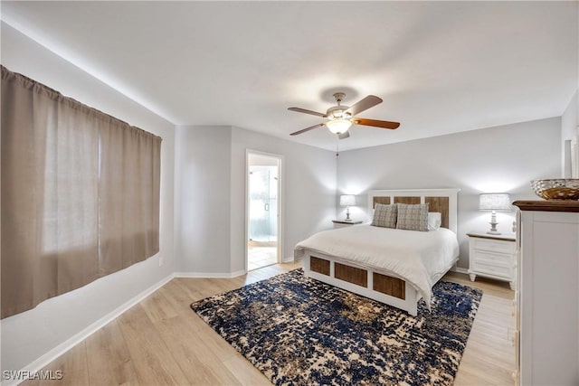 bedroom featuring ensuite bathroom, ceiling fan, and light hardwood / wood-style floors