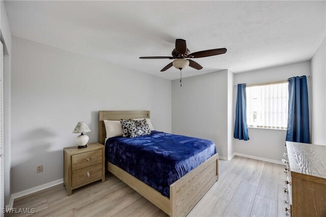 bedroom featuring ceiling fan and light wood-type flooring