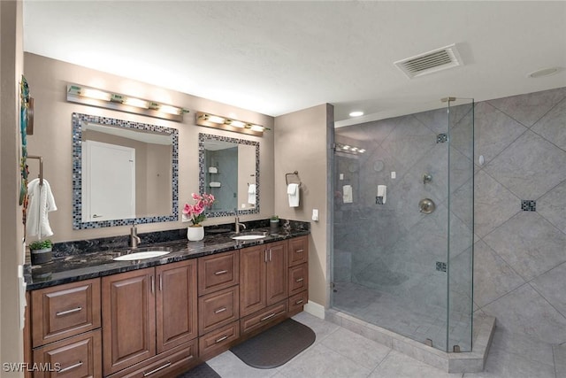 bathroom featuring vanity, tile patterned floors, and an enclosed shower